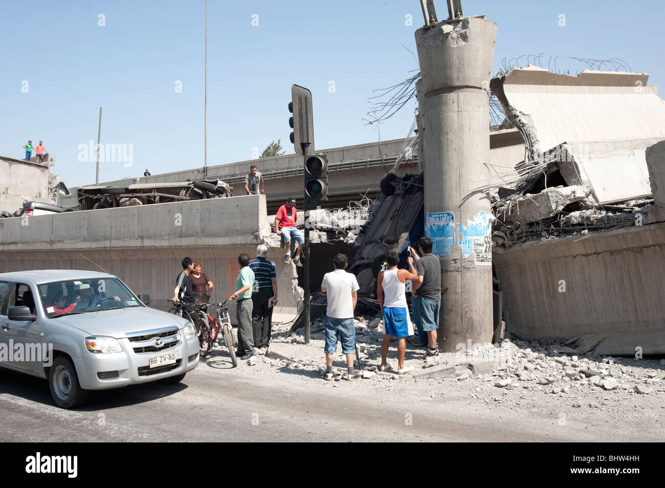 People Looking at the Ruins of the Collapsed Highway, Americo Vespucio Norte. Stock Photo