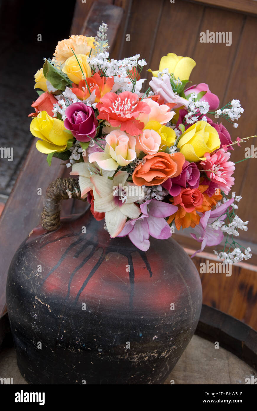 Silk flowers in a ceramic pot Stock Photo Alamy