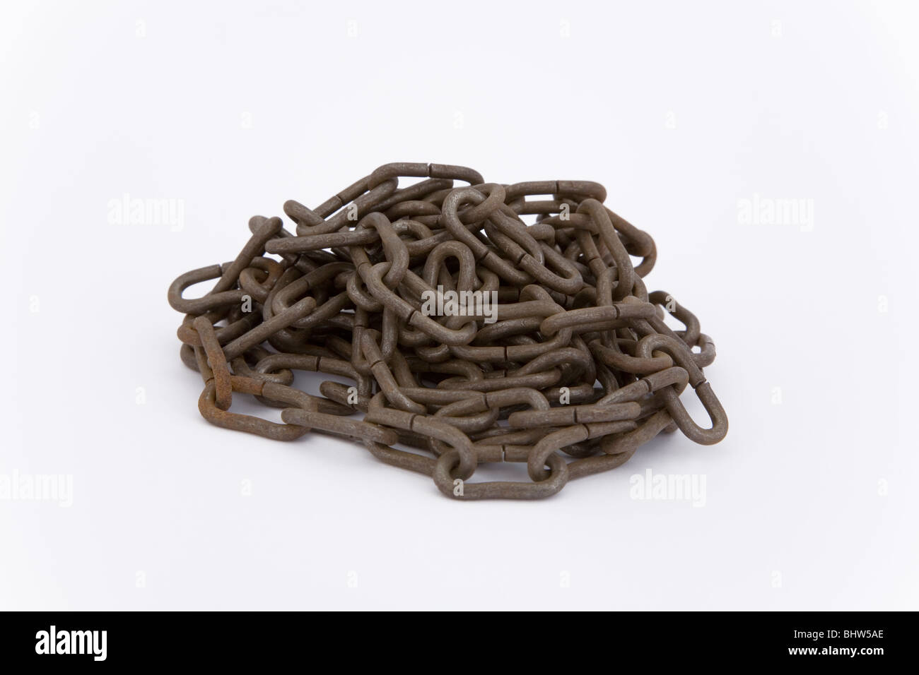 One stack of old rusty chain on white background link links metal metallic slavery freedom helotism harlotry thraldom thrall Stock Photo