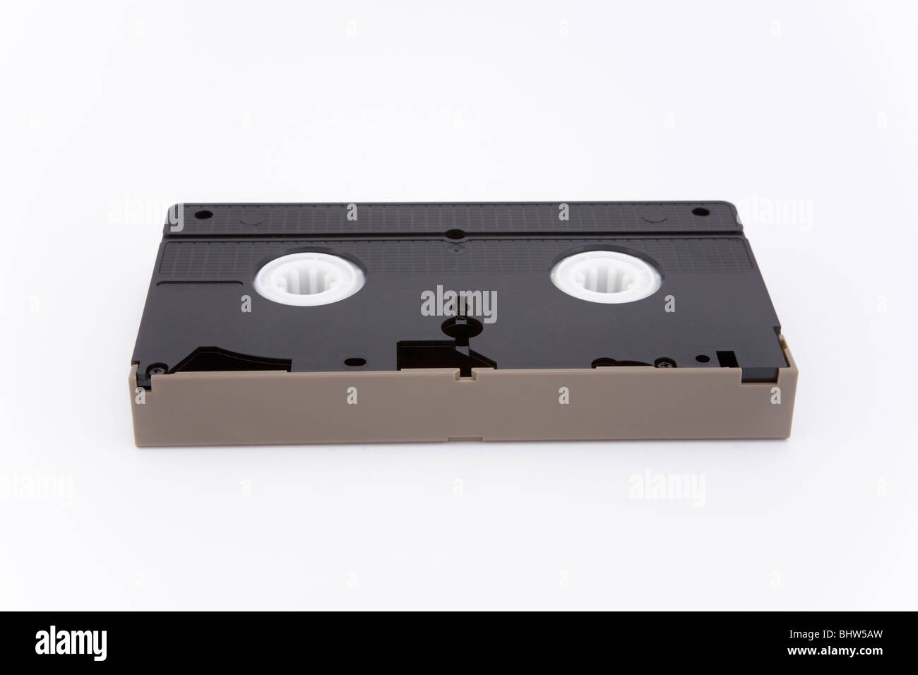 Old VHS video tape cassette white background record recording technology ancient useless innovation past superannuated sizable Stock Photo
