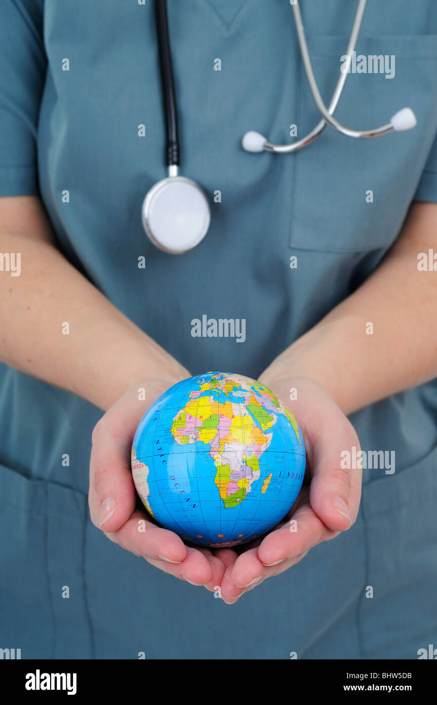 Female Doctor Holding A World Globe Stock Photo Alamy