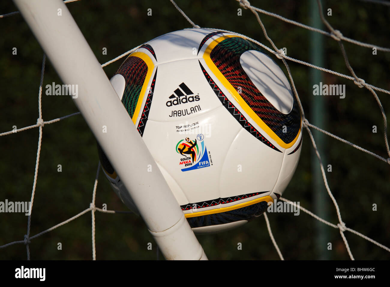 The FIFA 2010 World Cup replica match ball by Adidas, the Jabulani, in the  corner of a football net Stock Photo - Alamy