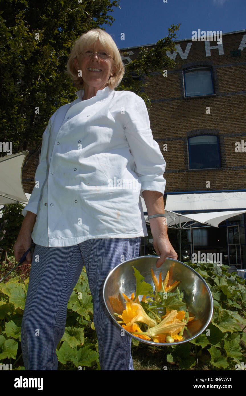 Rose Gray, chef and co-owner of the River Café picks zucchini flowers from  the garden at the restaurant to use her cooking Stock Photo - Alamy