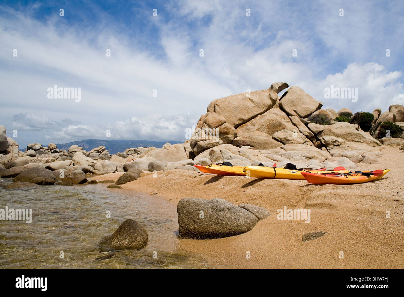 Canoes on the beach in Corsica Stock Photo