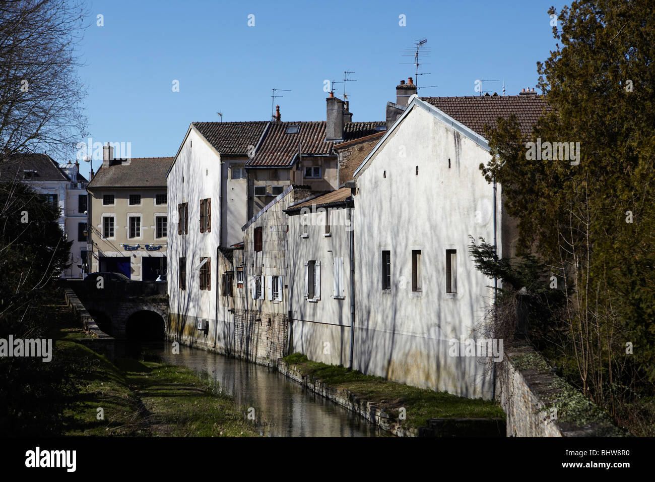 River flowing past riverside properties in Beaune, France Stock Photo
