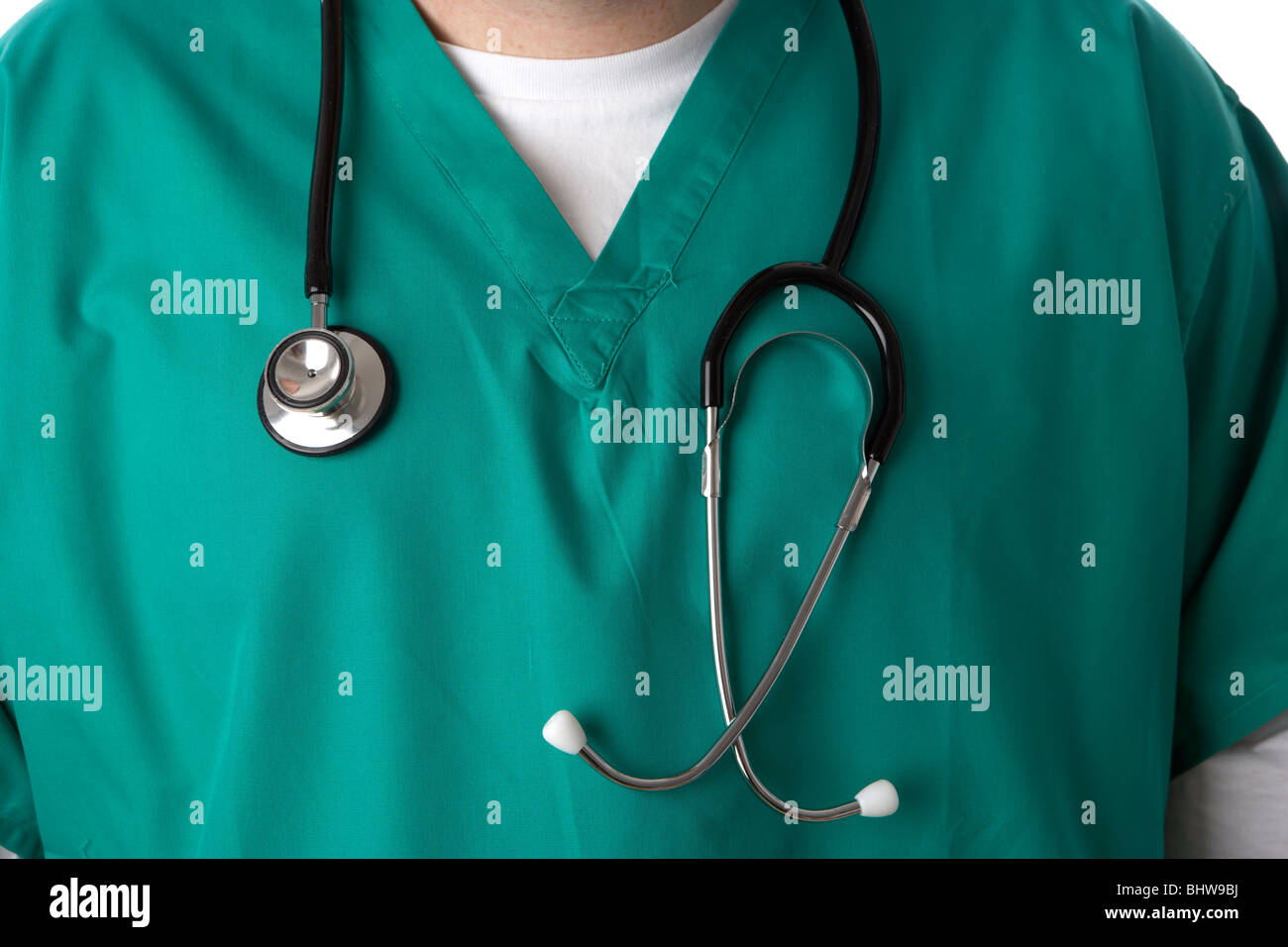 man junior doctor or nurse wearing green medical scrubs and stethoscope Stock Photo