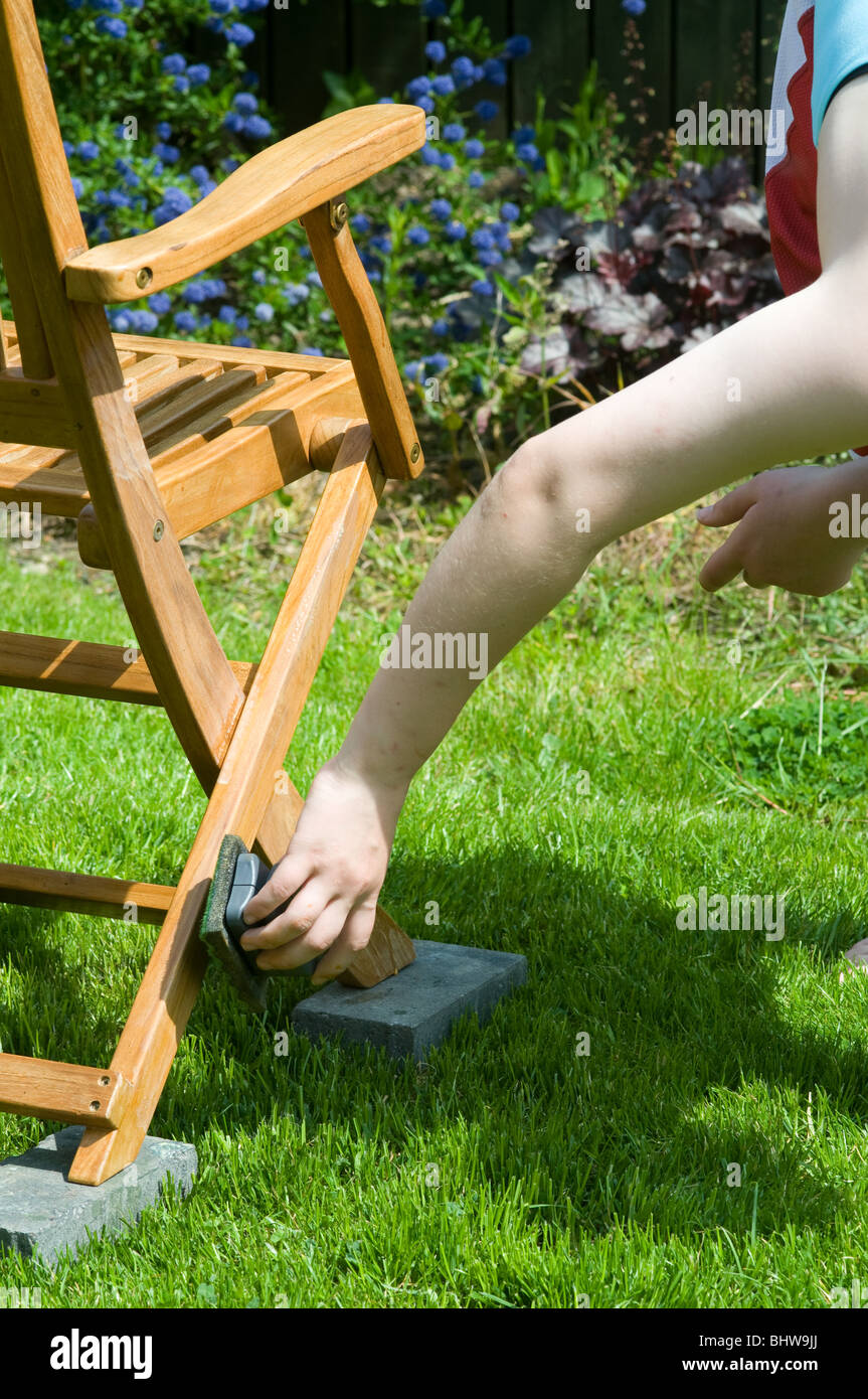 Applying Furniture Oil to Hardwood Garden Furniture Stock Photo Alamy