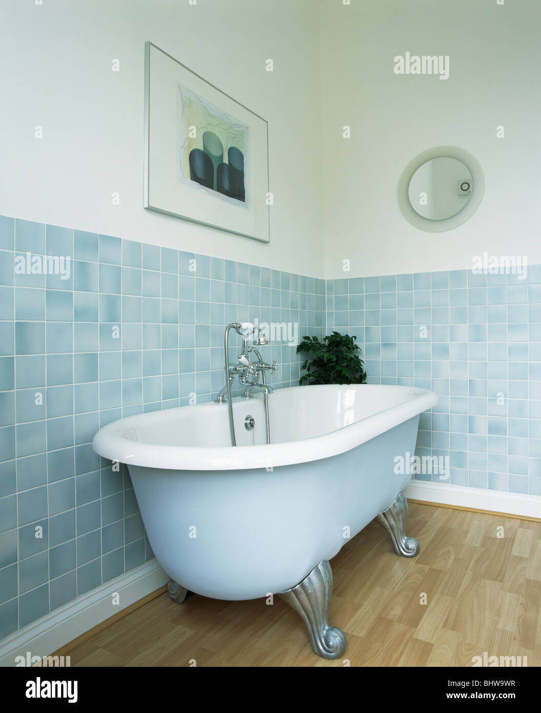 Pale Blue Roll Top Bath In Modern Bathroom With Pastel Blue Wall Tiles