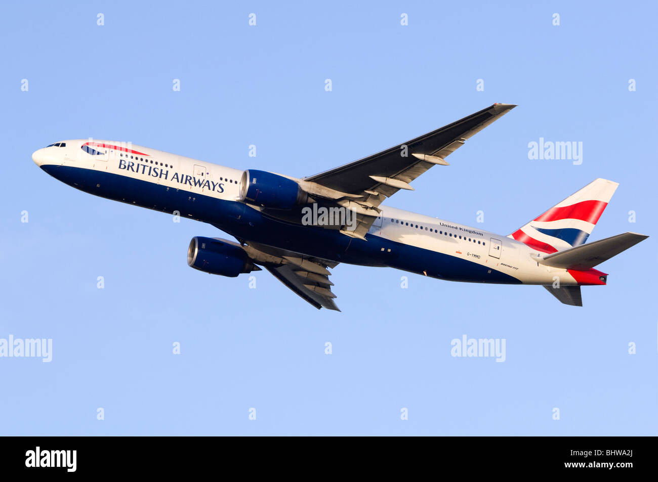 Boeing 777 operated by British Airways climbing out from take off at London Heathrow Airport Stock Photo