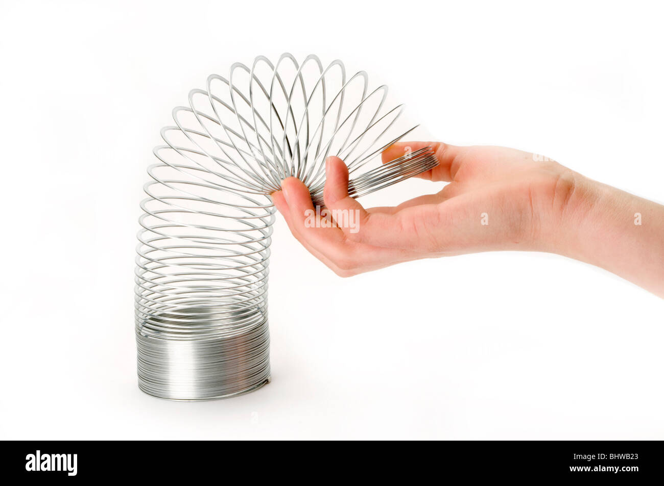 Slinky juguete de muelle de metal en espiral Fotografía de stock - Alamy