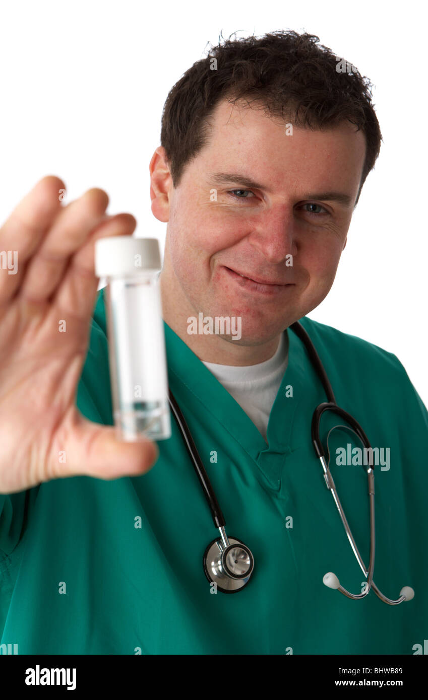 man wearing medical scrubs smiling holding out sample specimen bottle Stock Photo