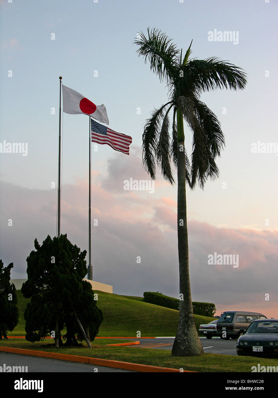 Japanese and American flags flying together in Okinawa, Japan Stock Photo