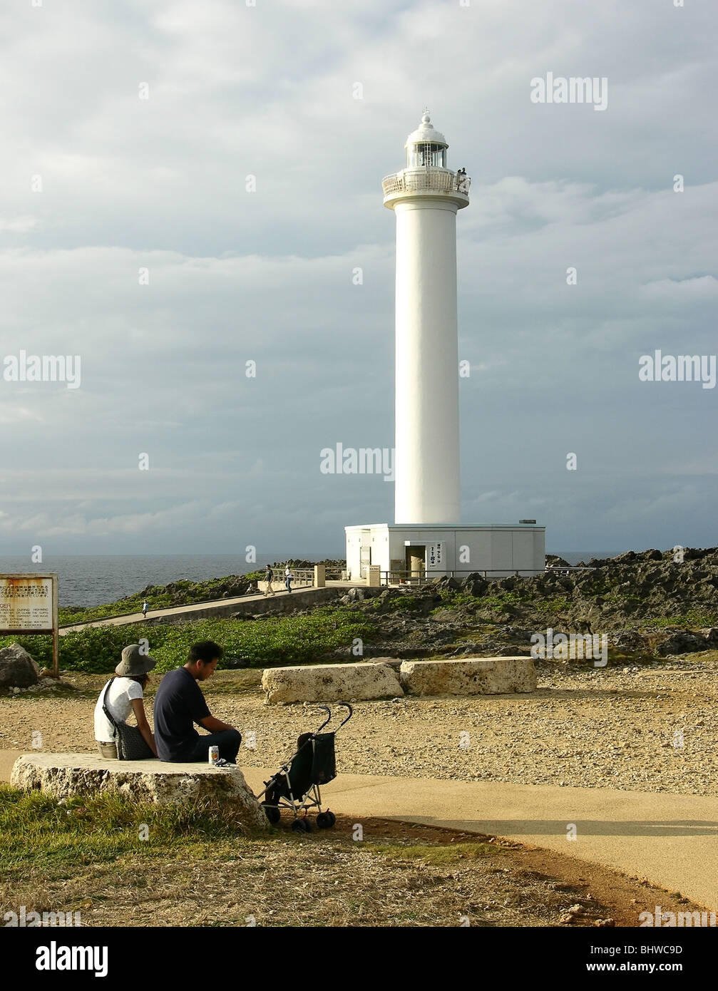 Family resting near Cape Zanpa Lighthouse, Okinawa Stock Photo