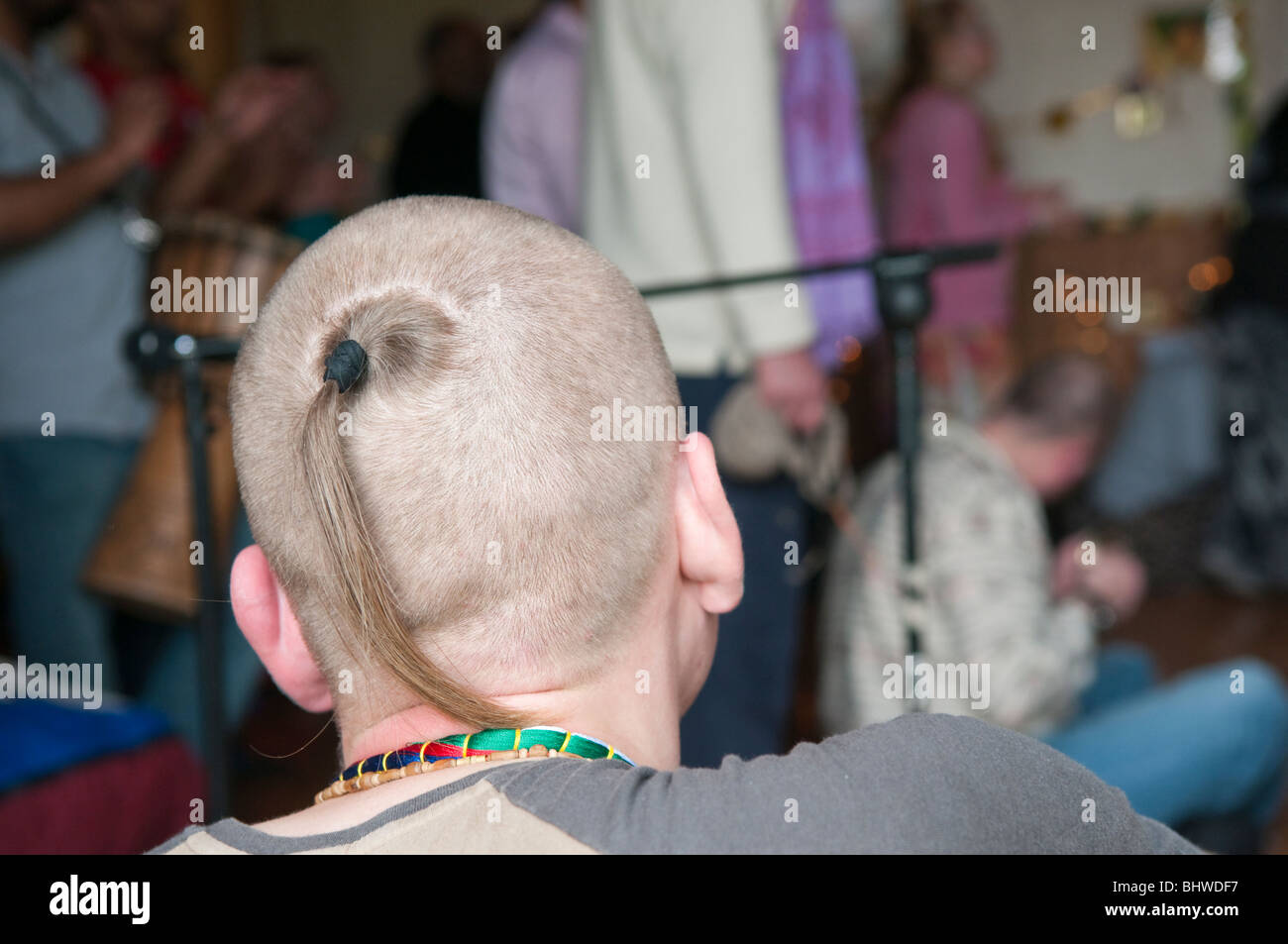 Hare Krishna sikha - a shaved head with a ponytail from the crown. Stock Photo