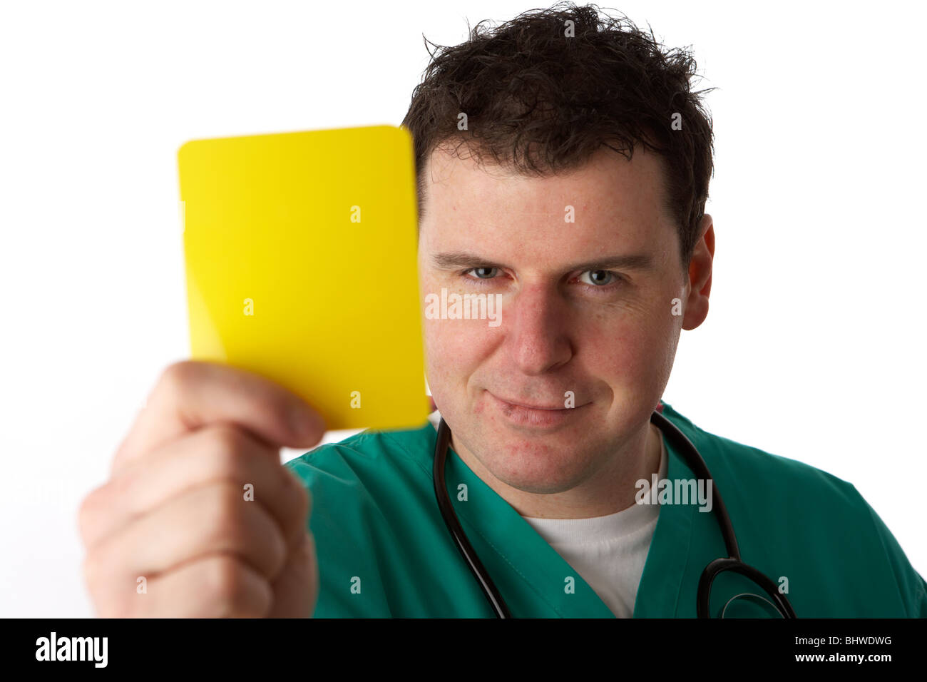 man wearing medical scrubs holding football yellow warning card giving