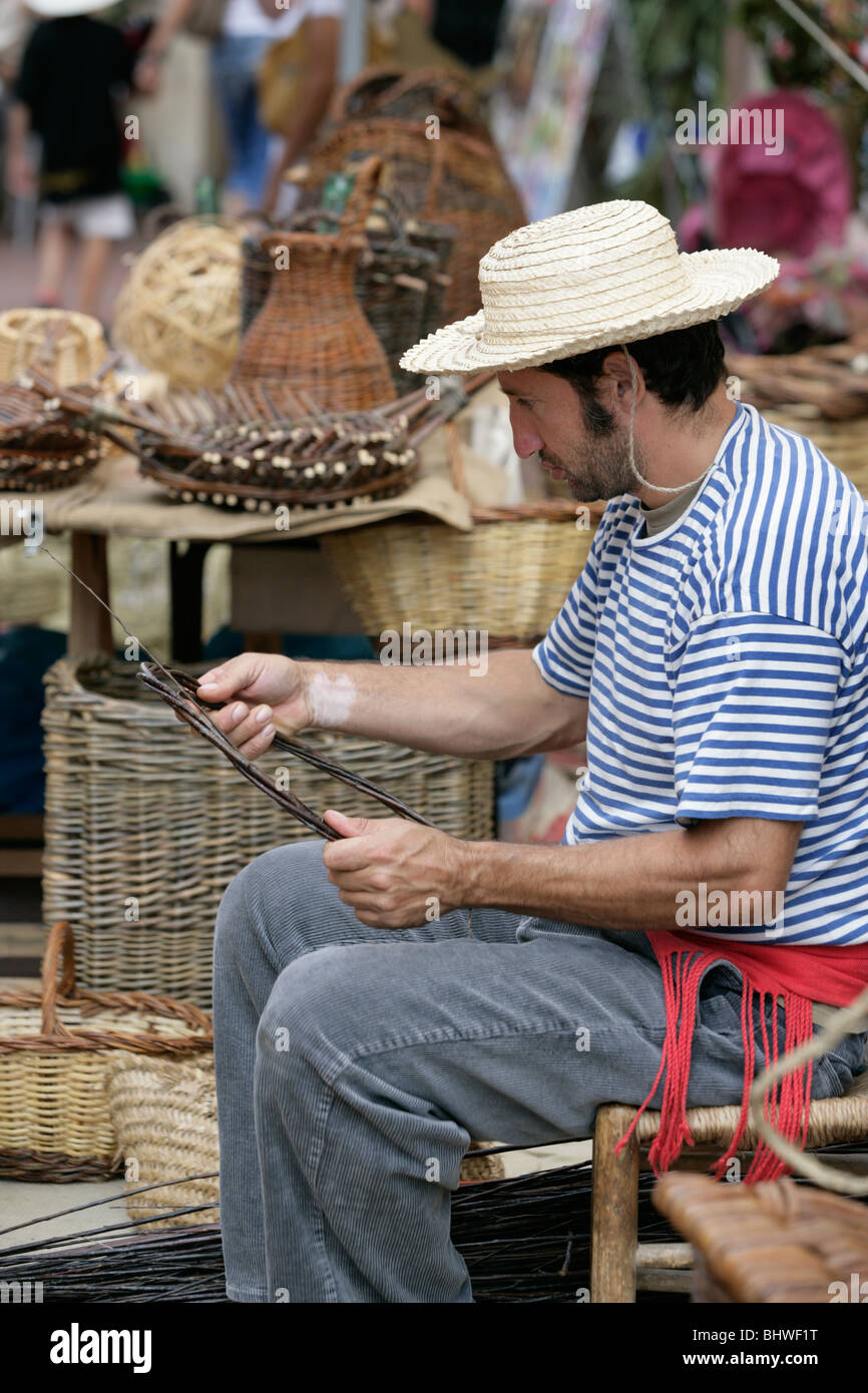 Woman making a wicker basket Stock Photo Alamy