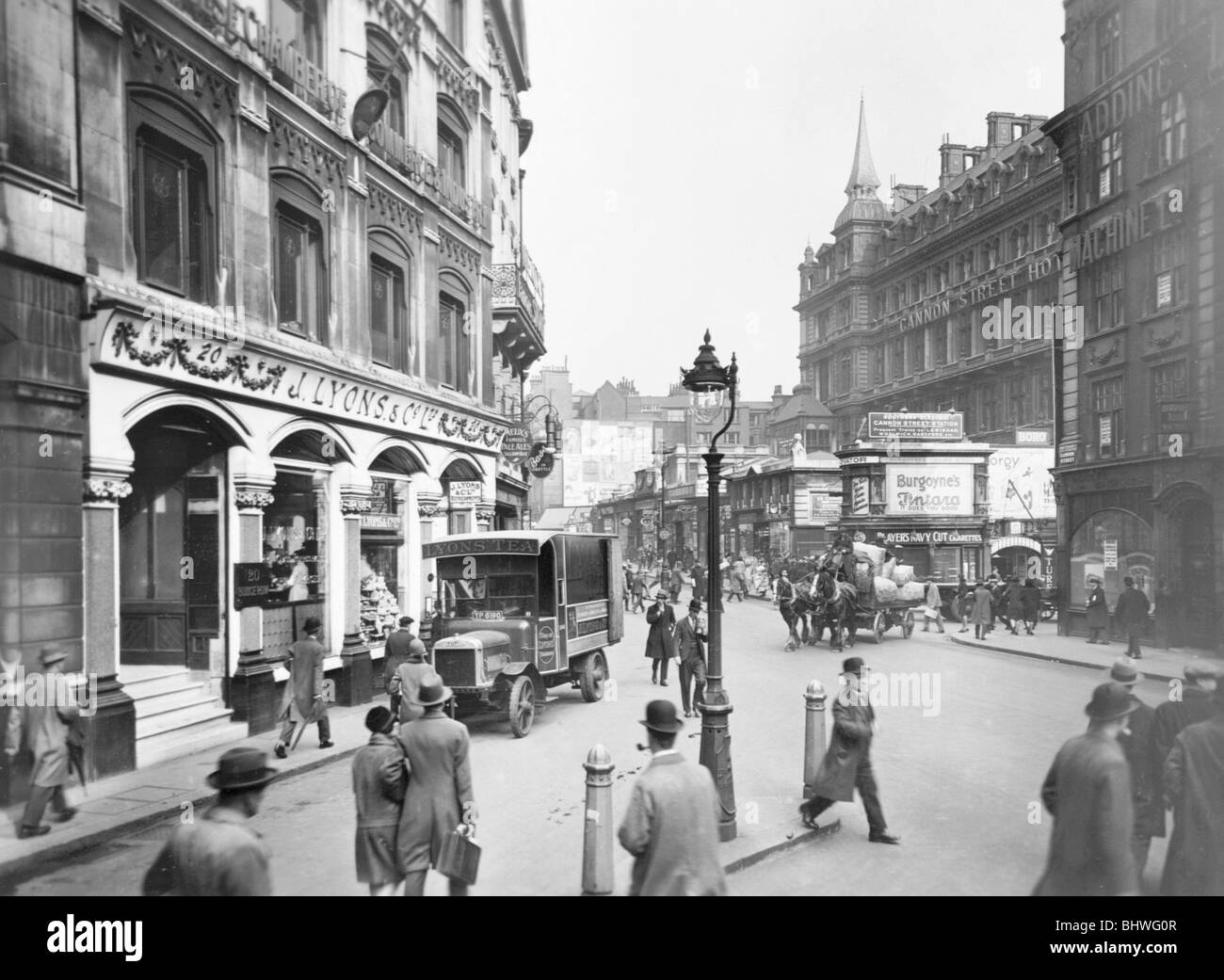 Cannon Street with Lyons shop, hotel and station, London, c1920-c1930.  Artist: George Davison Reid Stock Photo