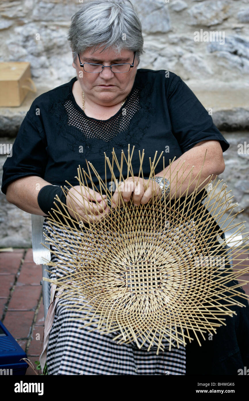 Woman making a wicker basket Stock Photo Alamy