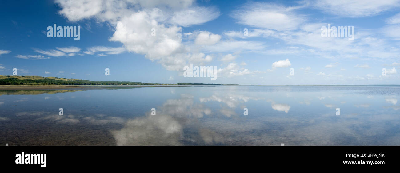 Stitched panoramic view of cloud and water reflection over Lake St Lucia in the Isimangaliso Wetland Park, Kwazulu Natal, South Africa Stock Photo
