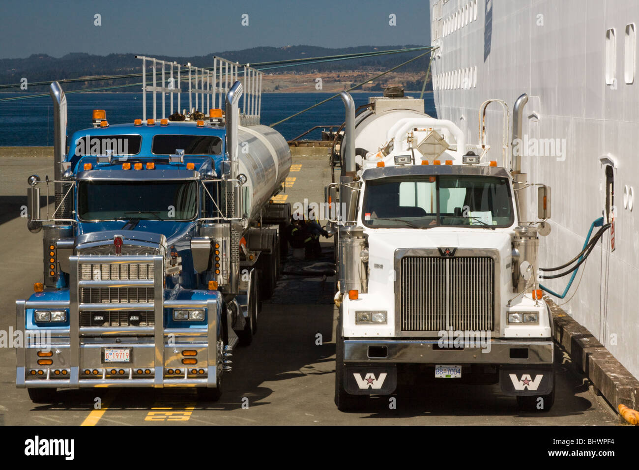 cruise ship refueling from fuel truck tankers with fuel oil Stock Photo