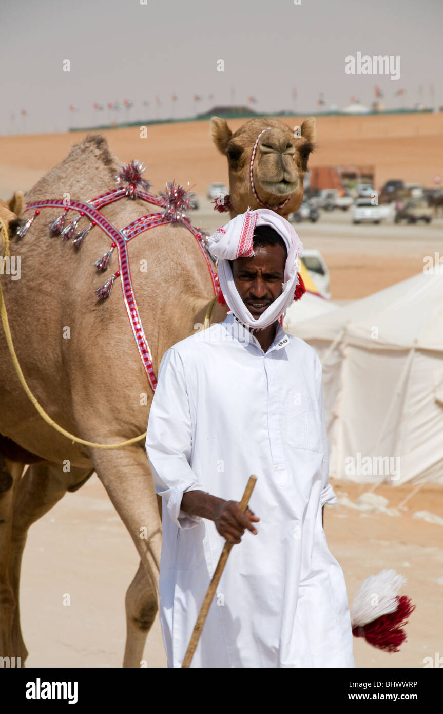 Traditionally dressed Arabic camel herders at the Al Dhafra camel