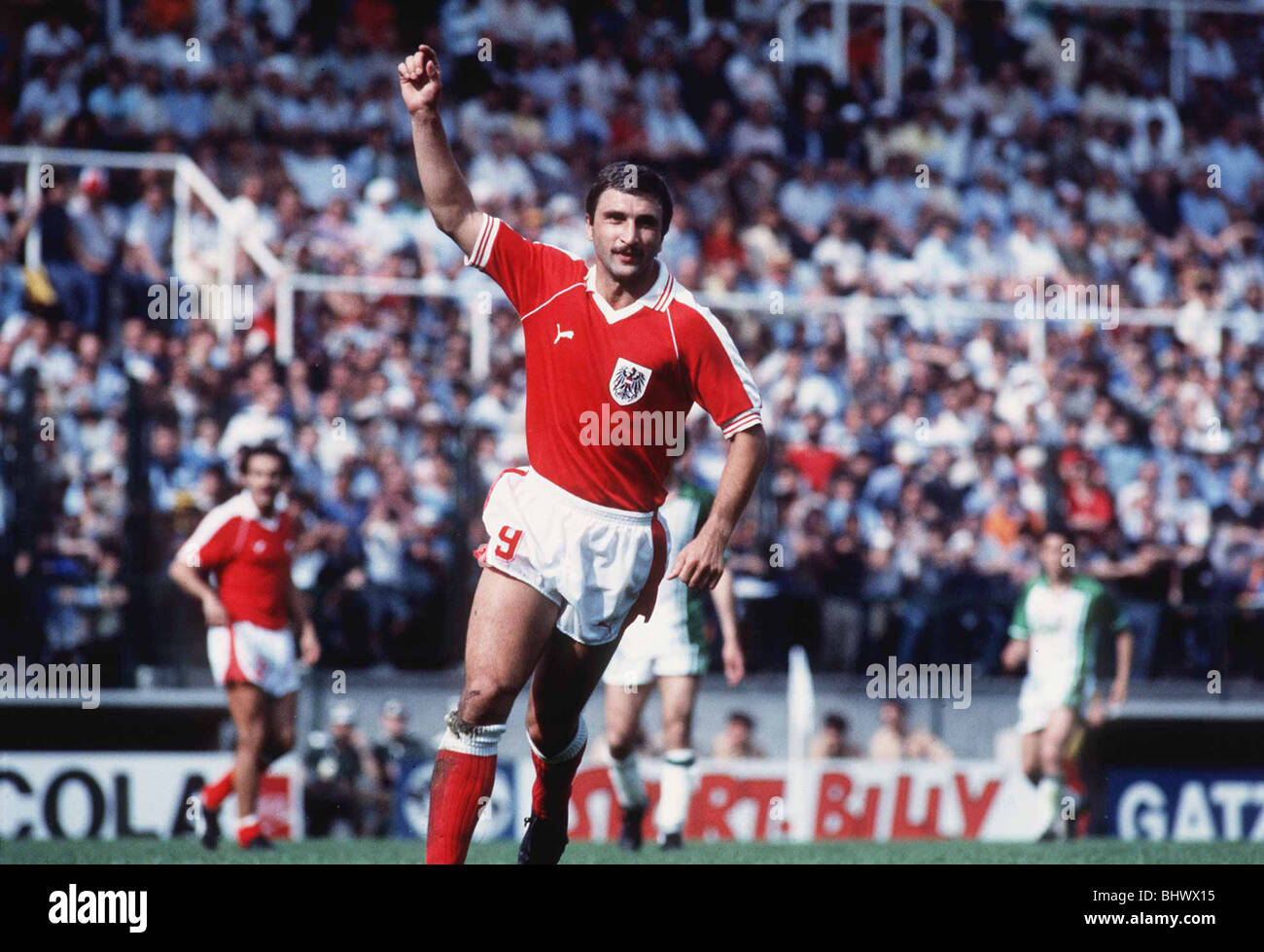Algeria v Austria in 1982 World Cup Hans Krankl of Austria raises his arm in celebration after scoring second goal of the game Stock Photo