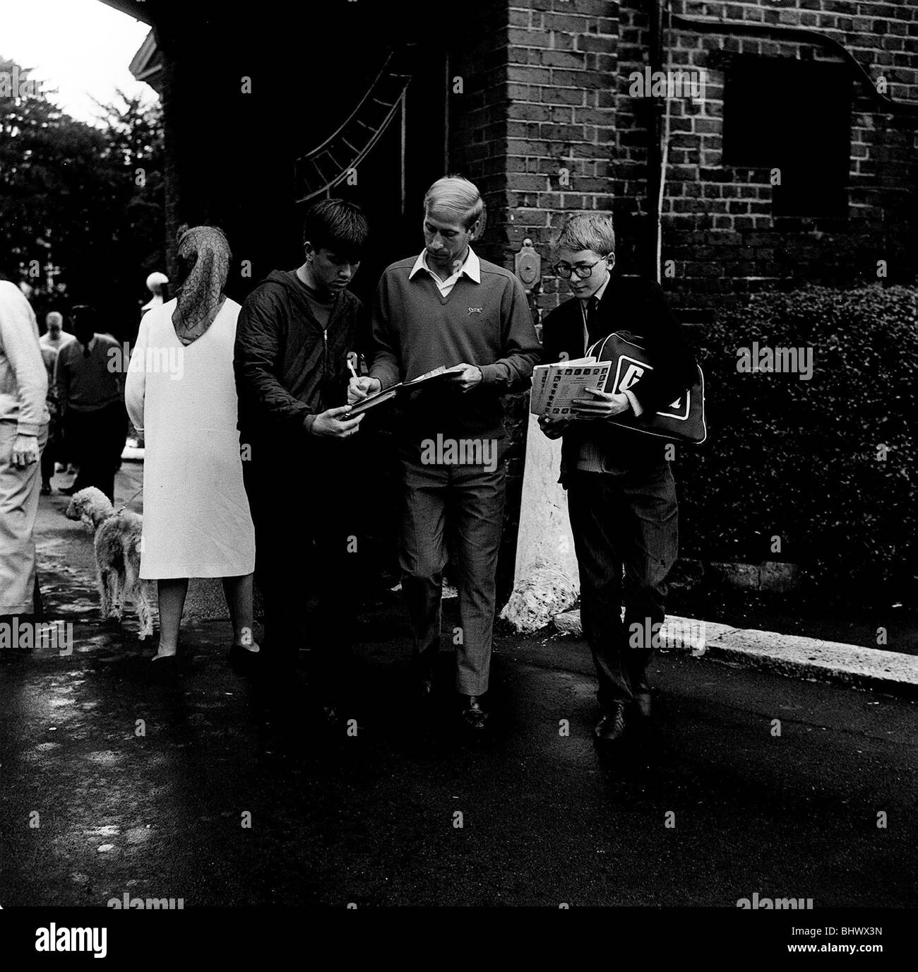 Bobby Charlton, Manchester United & England football player, signing autographs on day after winning World Cup July 1966. Stock Photo