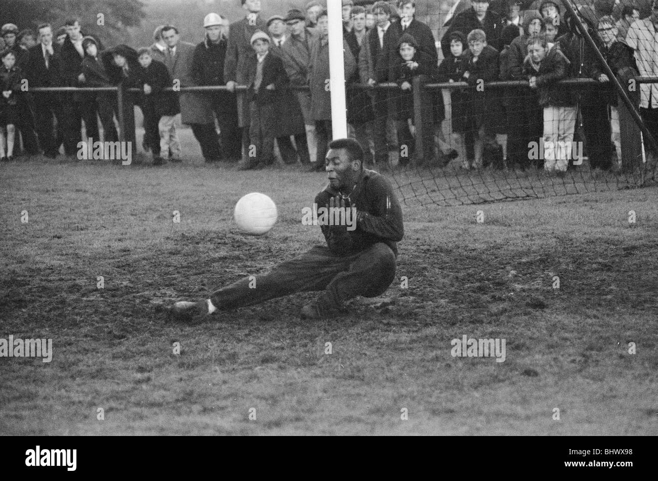 1966 World Cup Tournament in England. Star of the Brazil football team Edson Arantes Do Nascimento, more commonly known as Pele, takes a turn in goal during a training session at Bolton. 11th July 1966. Stock Photo