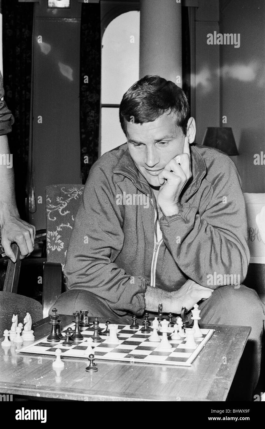 1966 World Cup Tournament in England. Lajos Tichy of the Hungary football team plays a game of chess to pass away the time on a Stock Photo
