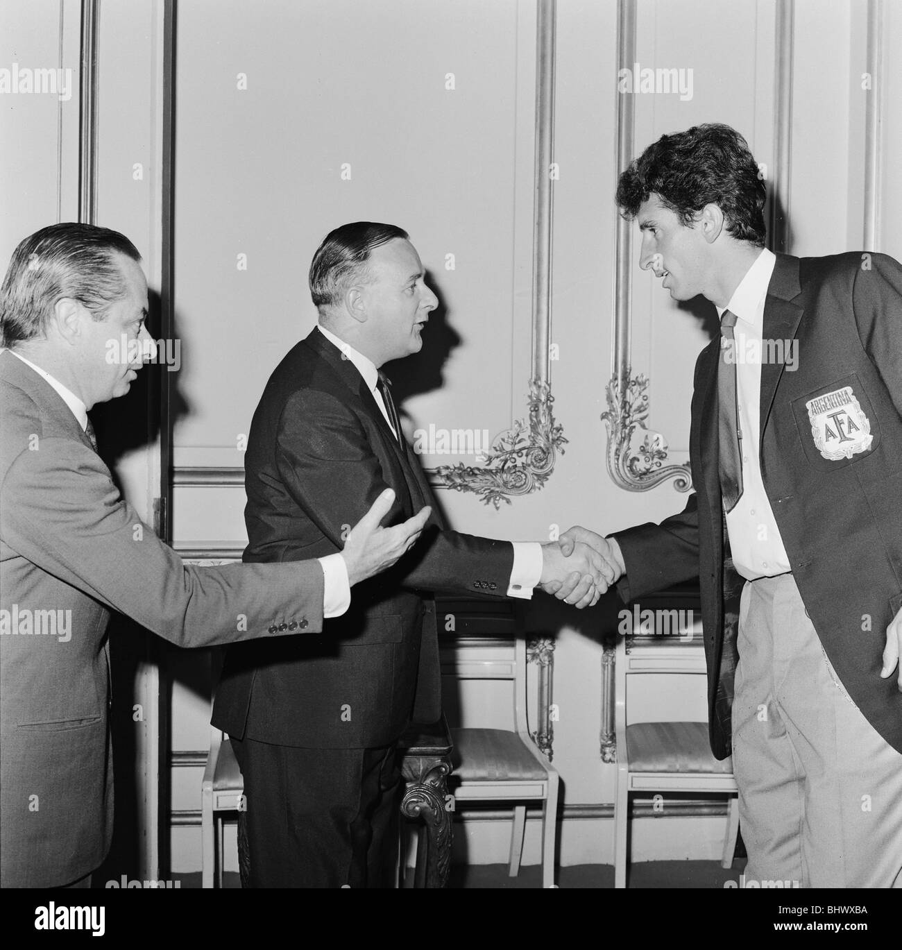 1966 World Cup Tournament in England. Antonio Rattin, captain of the Argentina football team who was sent off in disgrace against England in the quarter final match, shakes hands with Minister of Sport Dennis Howell at a Lancaster House reception hosted for the four losing quarter finalists. 24th July 1966. Stock Photo