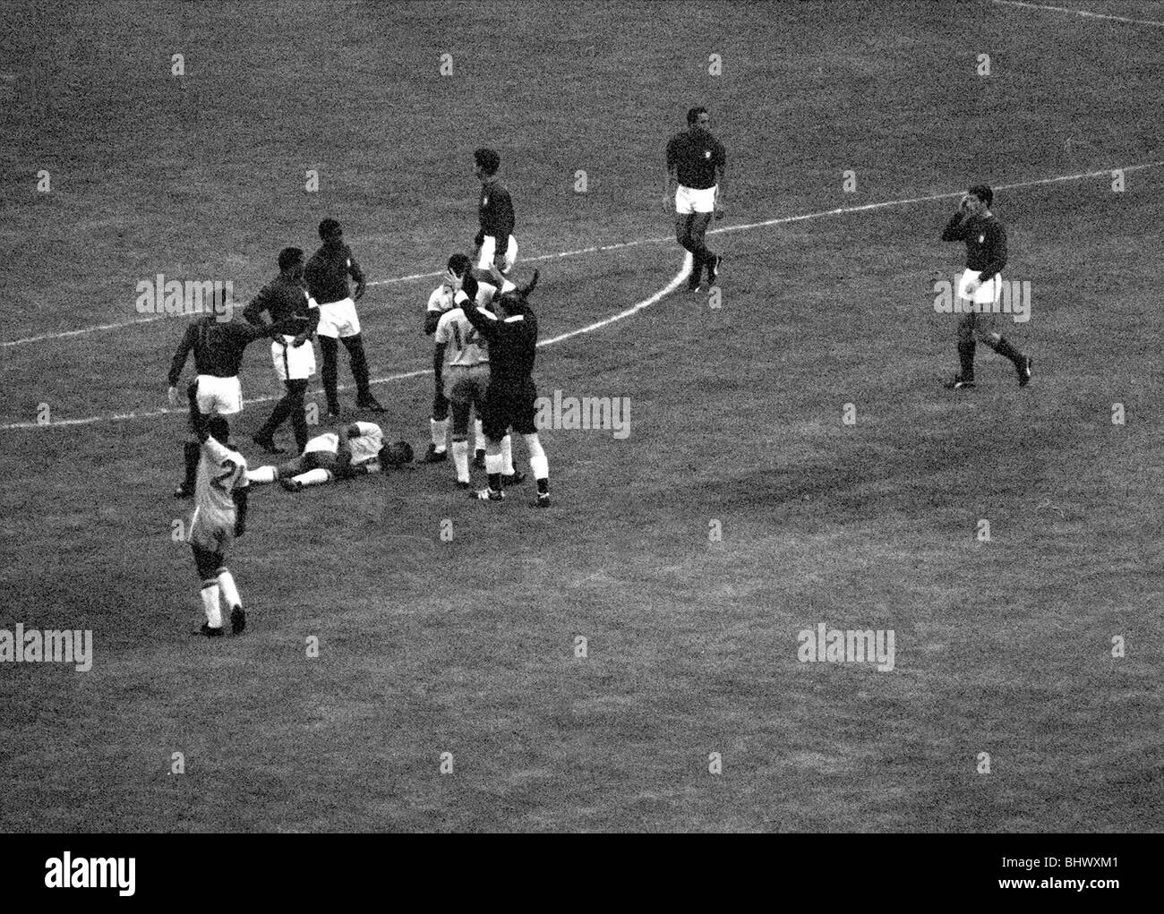 International Football July 1966 Brazil v Portugal World Cup 1966 Group Phase Pele lies injured on floor Stock Photo