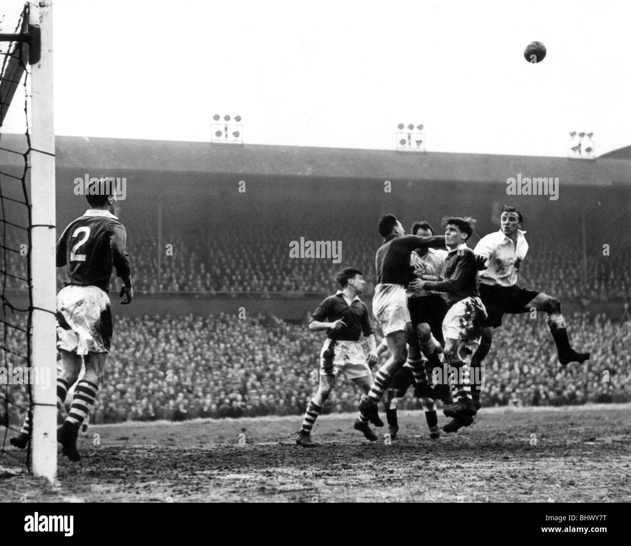 F.A. Cup 6th Round Replay 1955. Newcastle United 2-0 Huddersfield Town. 16.03.55. Action in the Huddersfield penalty area. Newcastle faced a testing time in the 1955 FA Cup run with replays against Nottingham Forest then Huddersfield Town in the quarter-final. Pictured is Vic Keeble, in a plain white change shirt, against the Tykes at St James’ Park. United won 2–0. Stock Photo