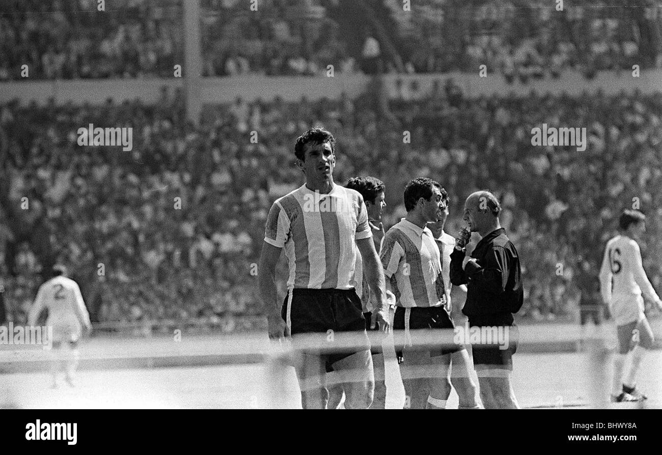 Argentinian players argue with Rudolph Kreitlin 1966 referee during quarter finals of World Cup against England where the game was stopped over sending Rattin off Stock Photo