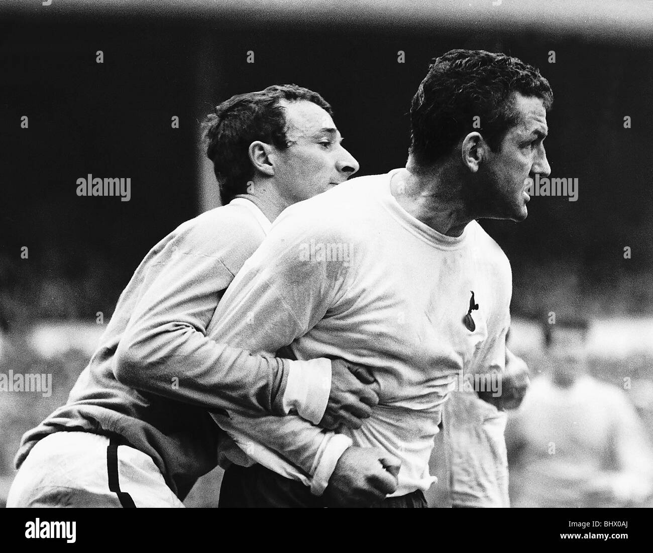 Dave Mackay of Spurs after a clash with Mike Summerbee of Manchester City May 1968 Stock Photo