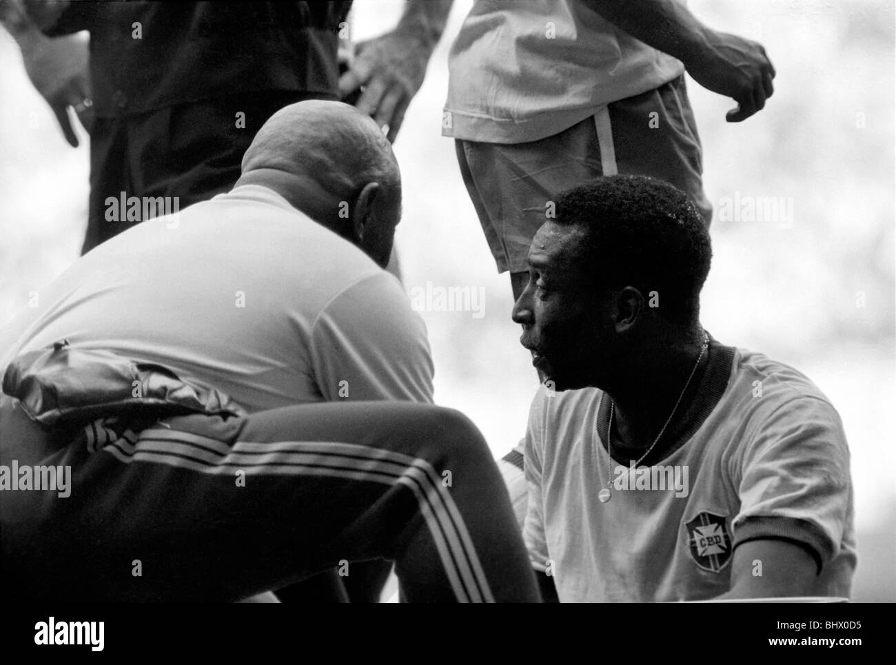 Pele is seen to by a medic. Brazil v. Uruguay: World Cup Semi-Final. July 1970 70-5871-042 Stock Photo