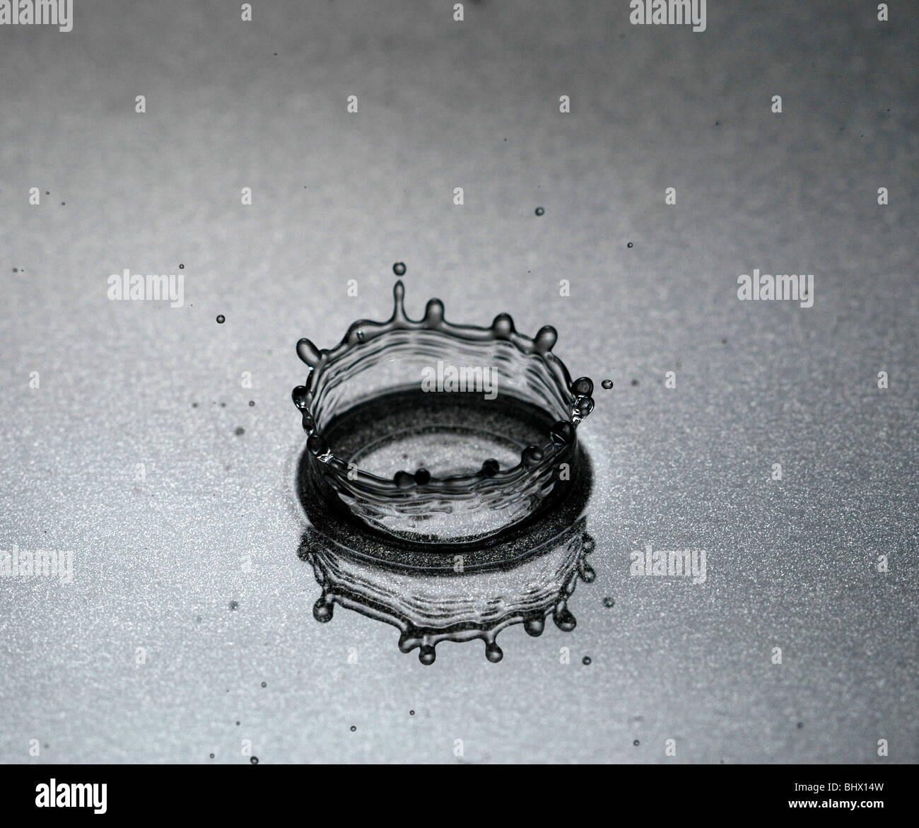 Shallow Splash Pool A water splash close up into a shallow pool Stock Photo - Alamy