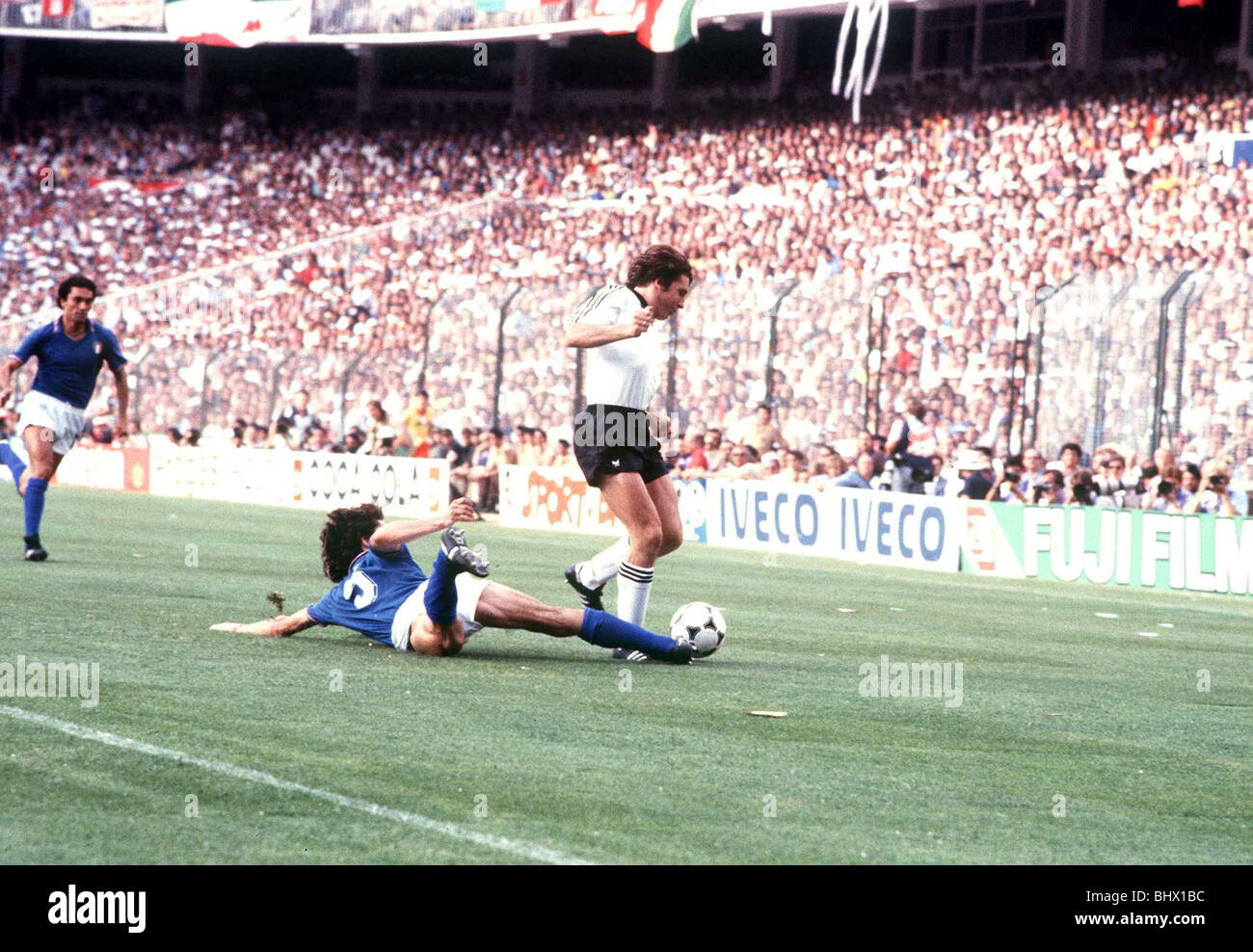 Collovati (Italy) tackles Fischer (West Gemany) 1982 in World Cup final Italy 3 West Germany 1 Stock Photo