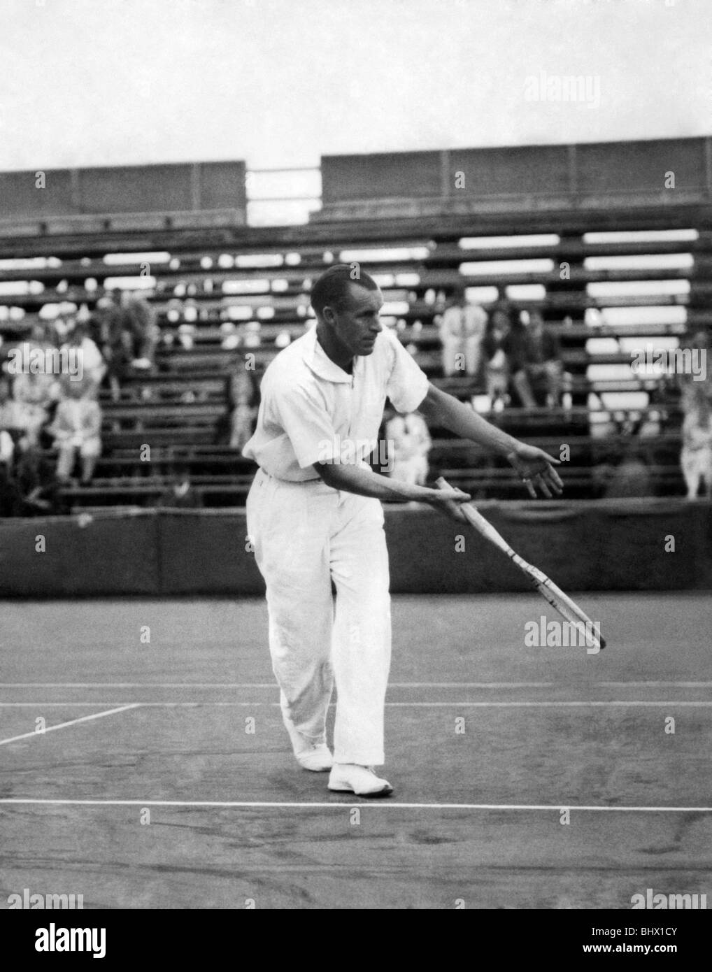 Bill Tilden in play at Southport in the International Pro Championship of Britain, held on outdoor hard courts.. July 1935 Stock Photo