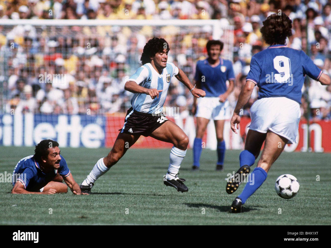 World Cup 1982 Italy 2 Argentina 1. Maradona leaves Claudio Gentile floored as Giancarlo Antognoni (9) attempts ball intercept Stock Photo