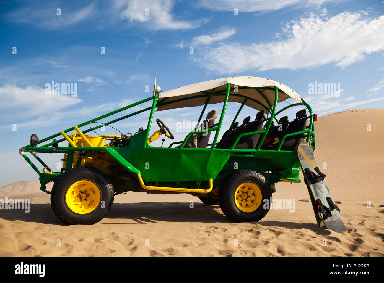 Dune buggy with boards for Sandboarding, Huacachina, Peru, South America Stock Photo