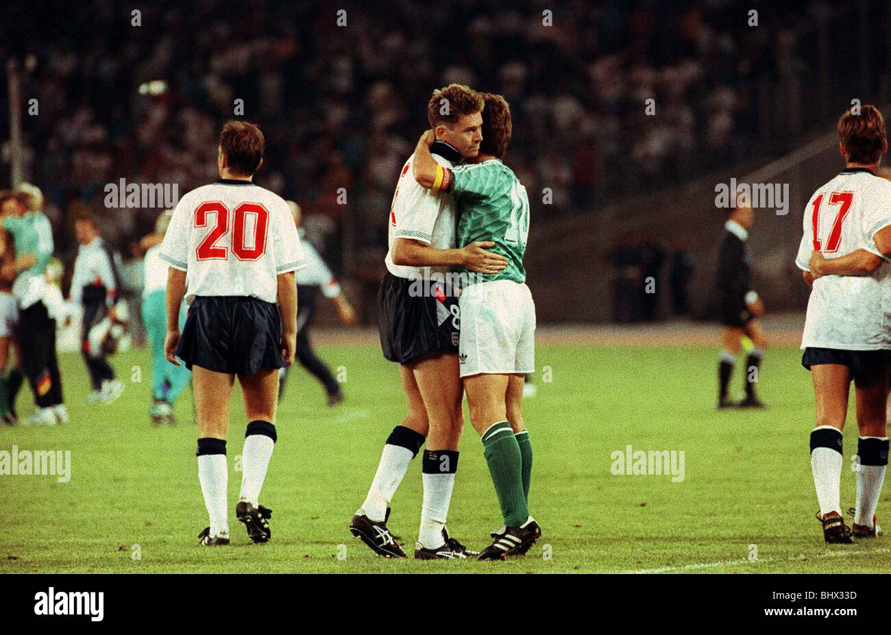 World Cup 1990 Semi Final England 1 West Germany 1 Chris Waddle Football is consoled and embraced by Lothar Matthaus of W Germany after the game in which Waddle missed a penalty in the 1990 World Cup semi Final in the England v West Germany game in Italy. England drew the game 1-1 but lost on penalties 4-3 dbase Stock Photo