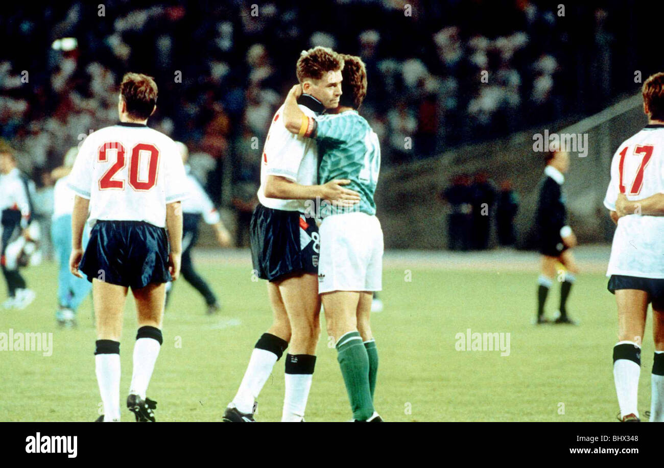 World Cup 1990 Semi Final England 1 West Germany 1 West Germany go through on penalties Chris Waddle is comforted by Lothar Matthaeus after missing a penalty Stock Photo
