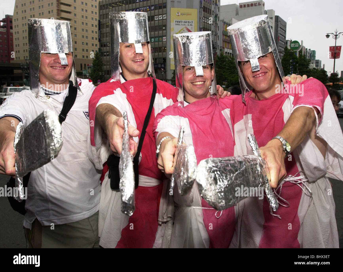 Football Fans Supporters June 2002 Pictured ahead of England v Denmark 2nd Round Match David Cookson, Alex Rigby, Neil Wilson and Chris Moore in Niigata dressed as Norman Soliders with foil helmets and swords Stock Photo