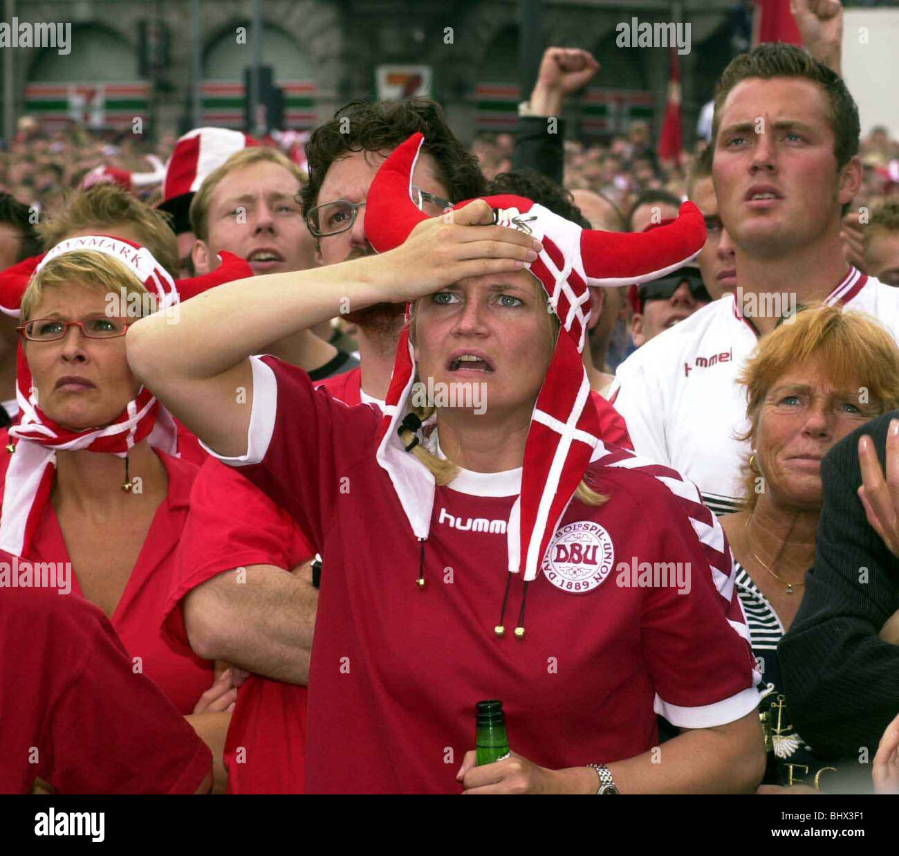 Football Fans Supporters June 2002 Pictured ahead of England v Denmark 2nd Round Match Danish fans watch their team's 3-0 defeat on a giant TV screen in Copenhagen Stock Photo