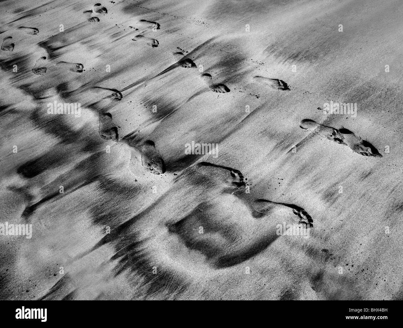 Foot-prints in sand Stock Photo