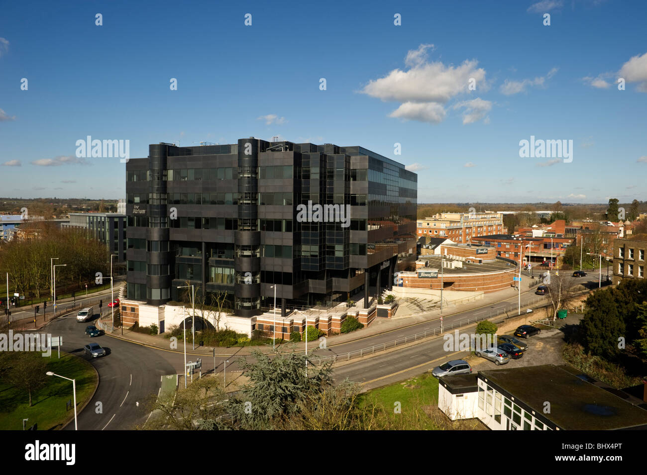 An aerial view of a modern contemporary office building in Uxbridge West London UK against a clear blue sky. Stock Photo