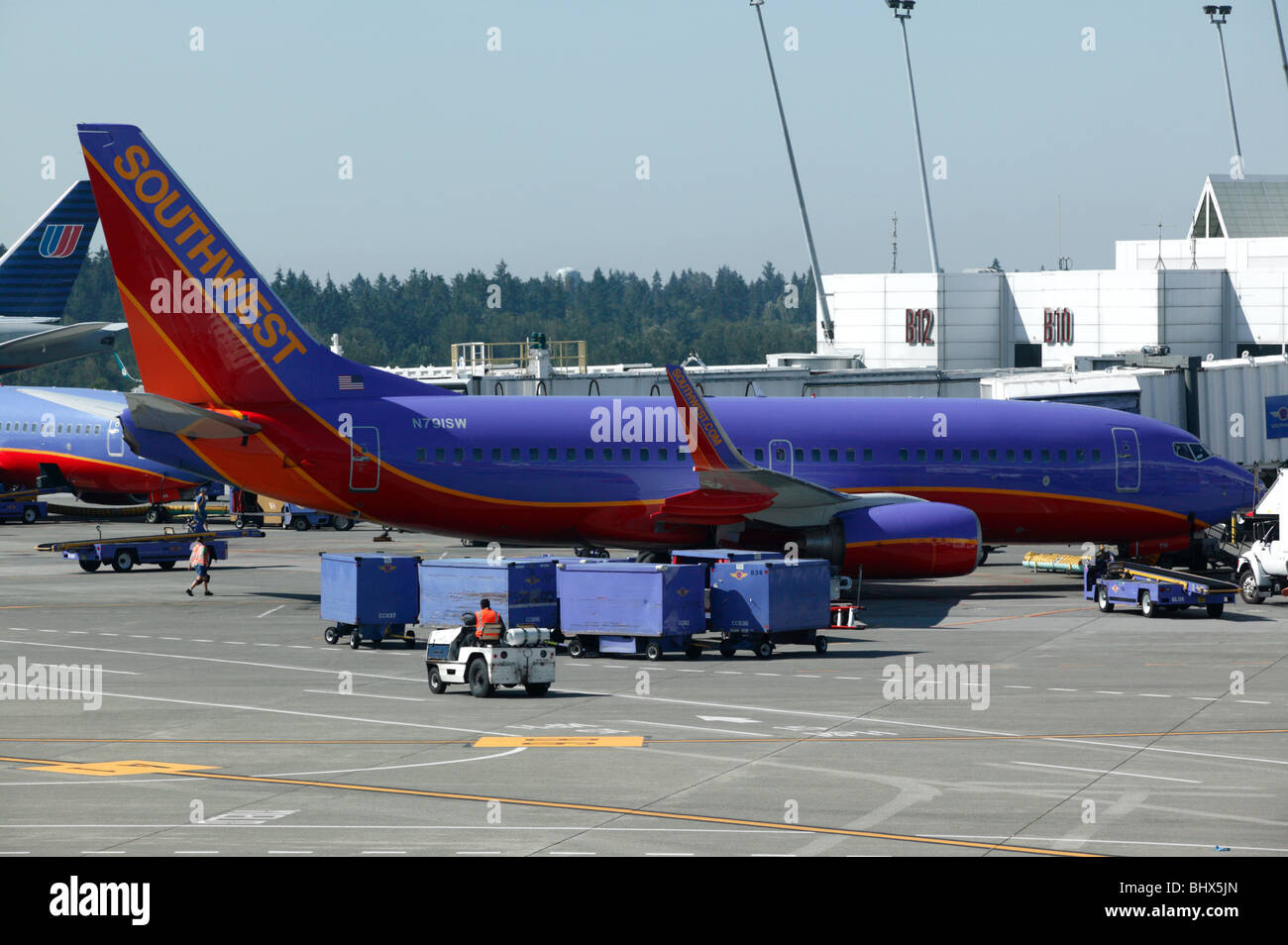 Southwest Airlines Boing 737700 at rest by Airport Terminal buildings Stock