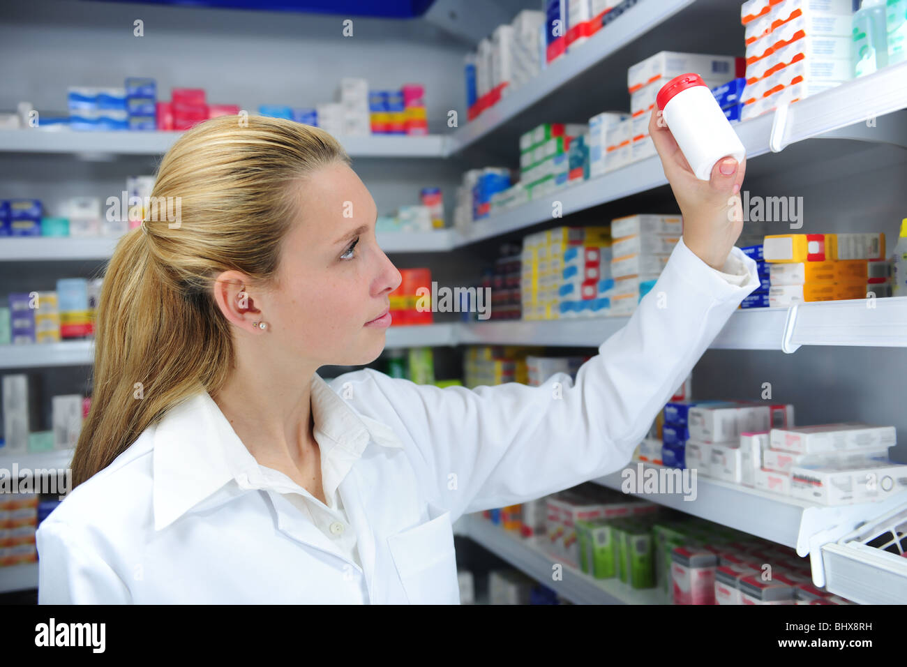 pharmacist at pharmacy searching the right medicine Stock Photo