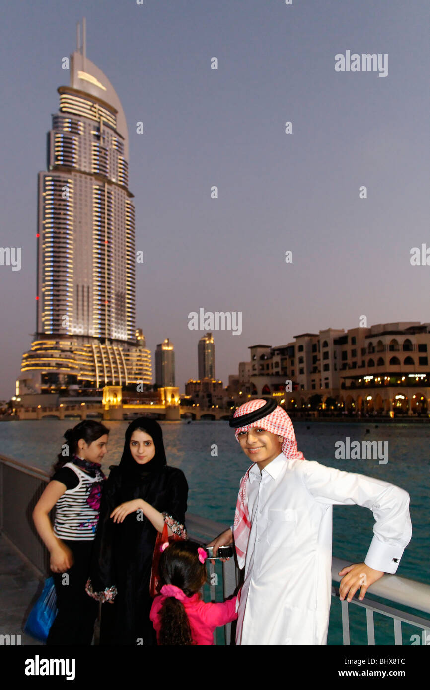 Arabian children in front of The Adress Five Star Hotel near Burj Khalifa and Dubai Mall,  Stock Photo