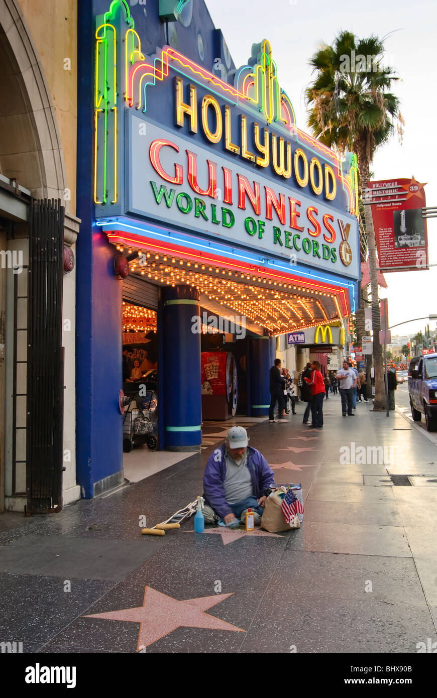 The Hollywood Guinness Museum of World Records on the Walk of Fame on Hollywood Blvd with someone polishing the stars. Stock Photo